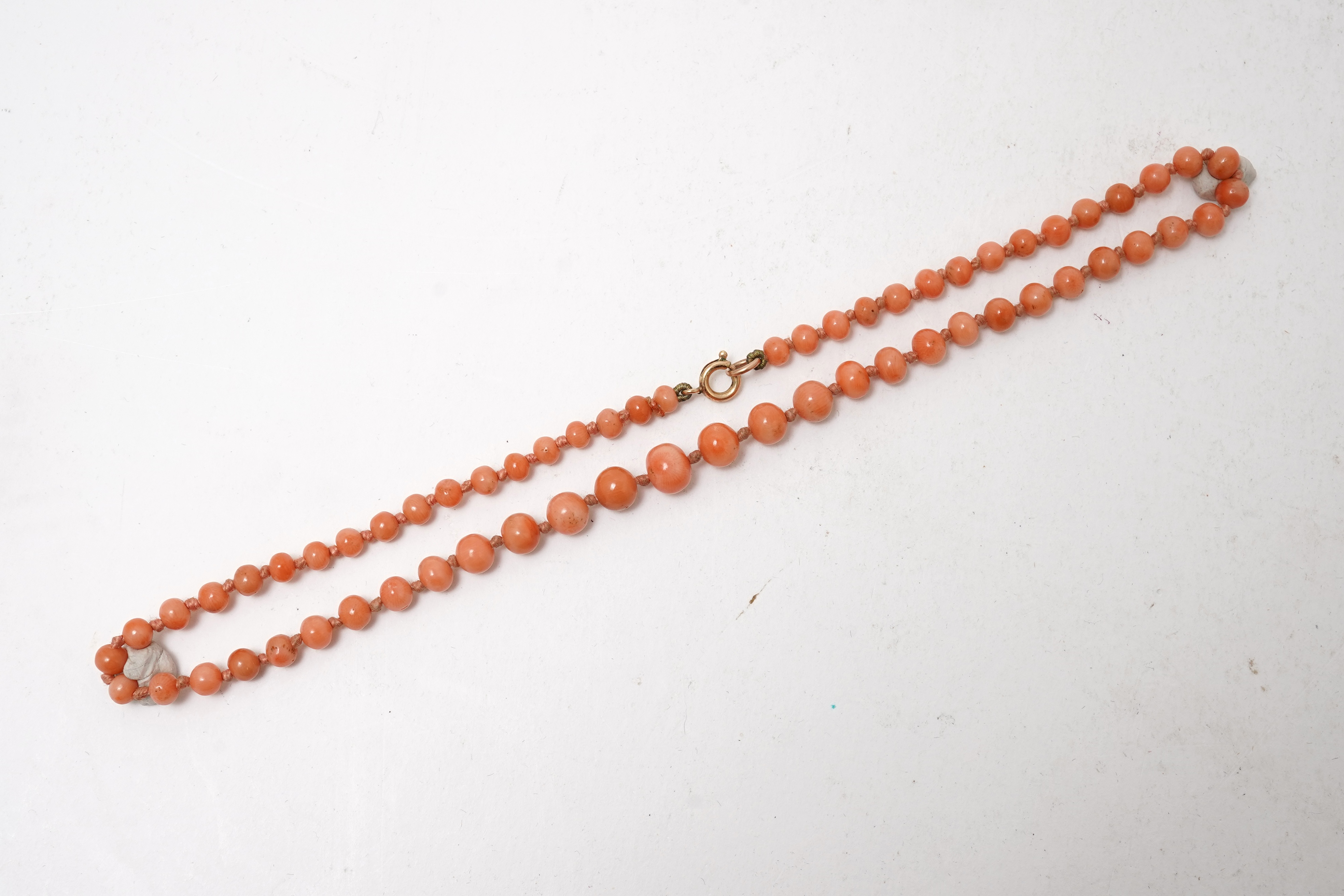 A collection of jewels including a coral necklace